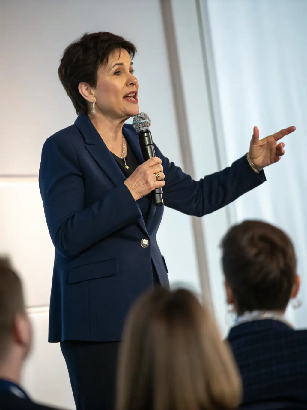 An image of a person confidently presenting to an audience, representing improved communication and leadership skills.